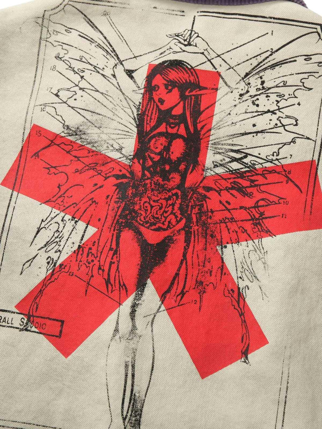 Intricate graphic design on TALISHKO's jacket, featuring bold red accents and artistic details.