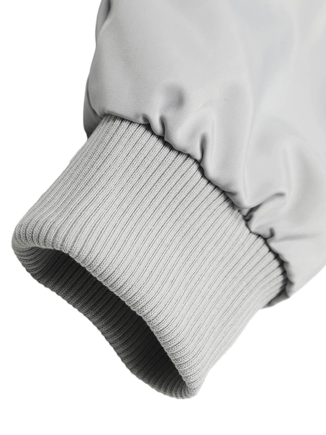 A close-up of the cuff on a TALISHKO retro work jacket, highlighting the ribbed texture.