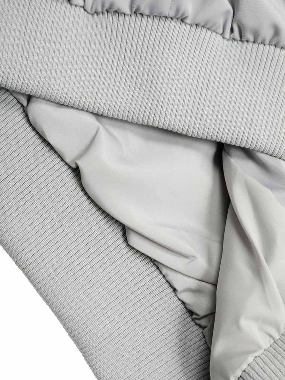 Detailed fabric and stitching on a TALISHKO retro work jacket, highlighting ribbed texture.