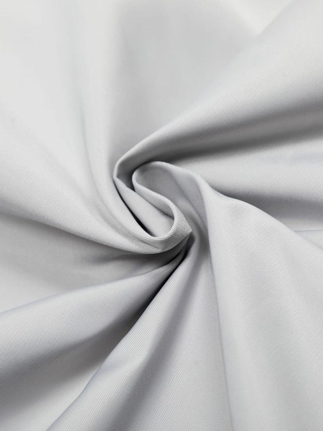 A close-up of the smooth gray fabric on a TALISHKO retro work jacket, showcasing its texture.