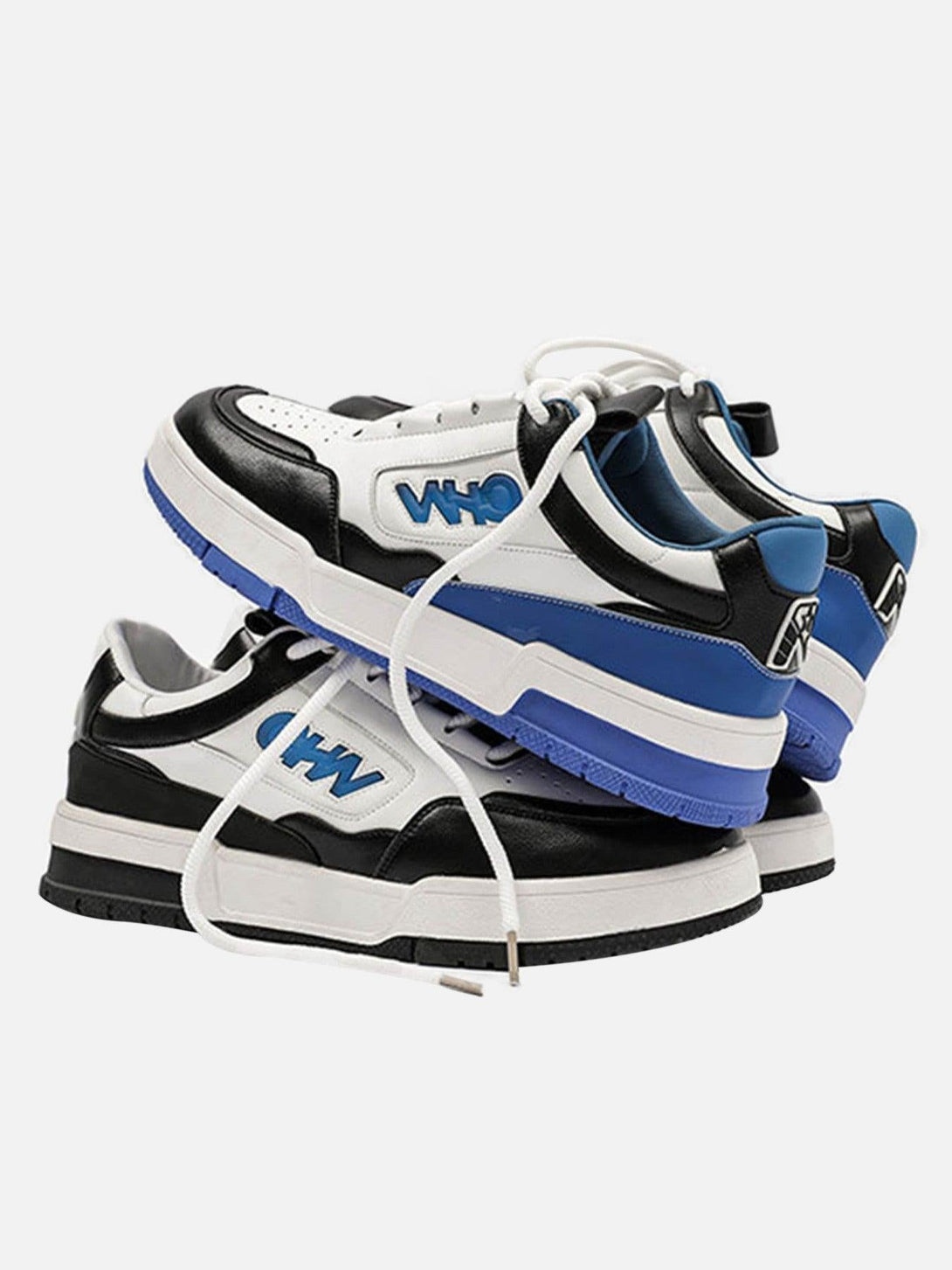 Stacked retro slip-on shoes by TALISHKO in black, white, and blue, showcasing bold design.