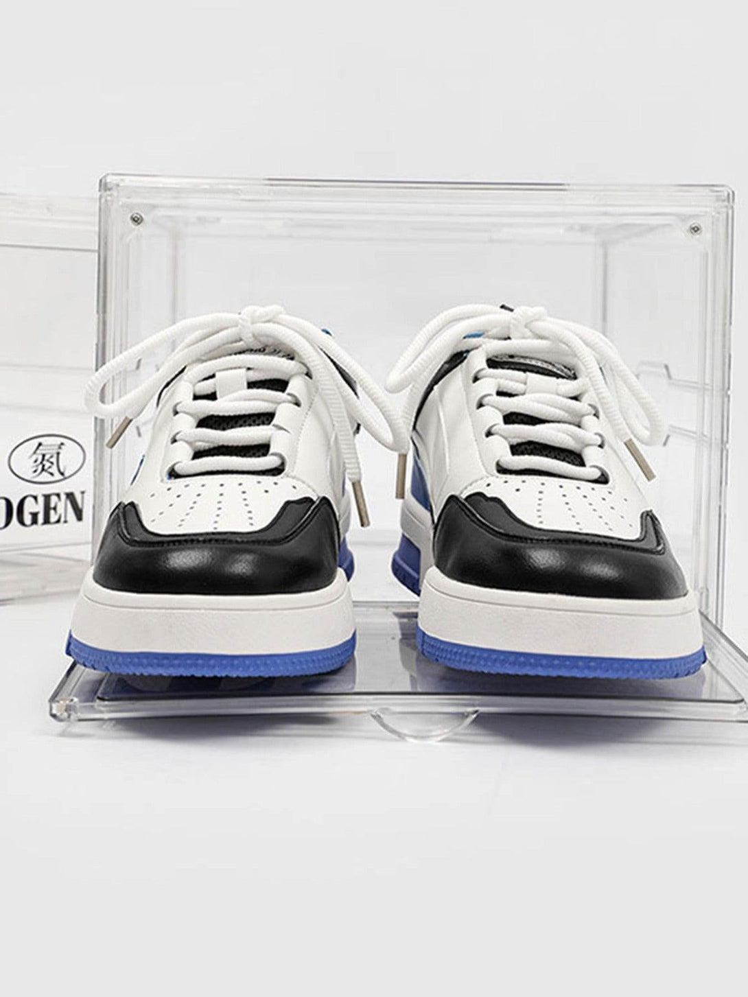 TALISHKO retro slip-on shoes in black and white, front view showcasing bold design.