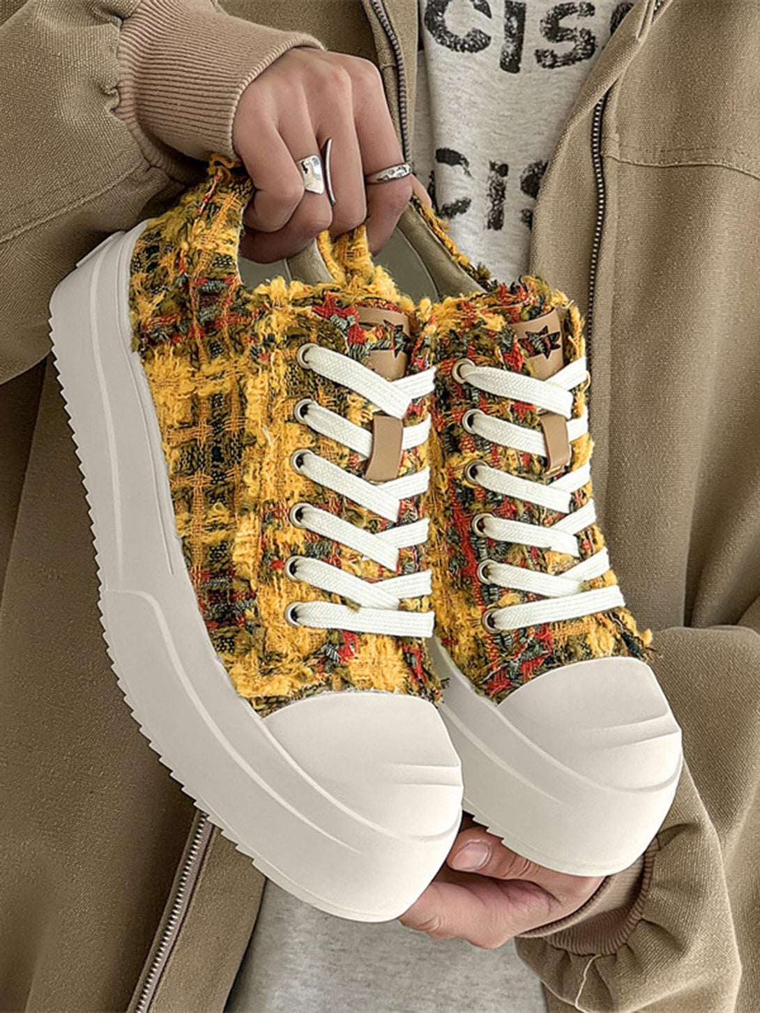 Retro canvas sneakers by TALISHKO in yellow, showcasing a unique textured design up close.