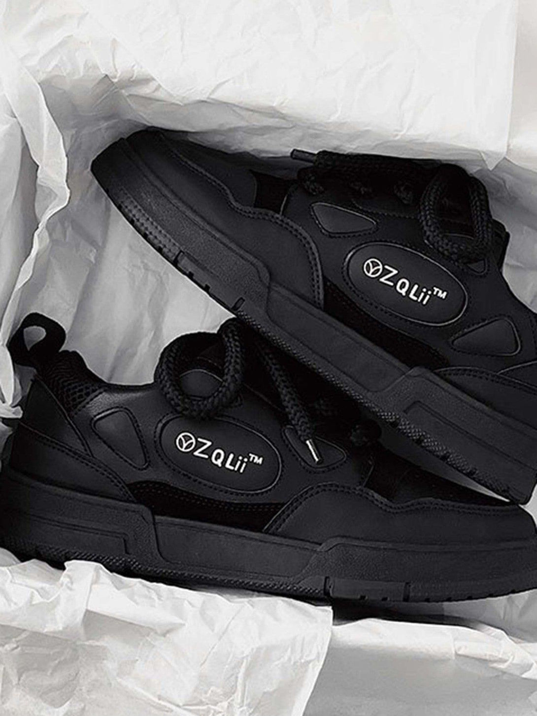 TALISHKO retro casual board shoes in black, presented in a stylish box with bold branding.