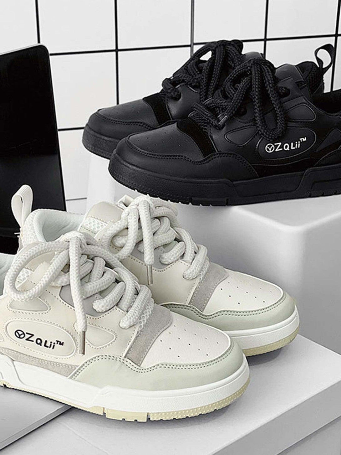 TALISHKO retro casual board shoes in black and white, showcasing a trendy dual-tone design.