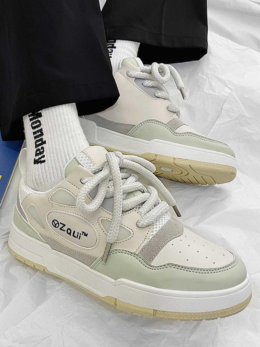 TALISHKO retro casual board shoes with a chic design and soft hues, worn with relaxed pants.