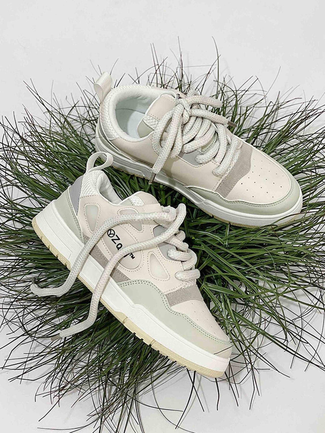 TALISHKO retro casual board shoes on grass, showcasing a stylish neutral-toned design.