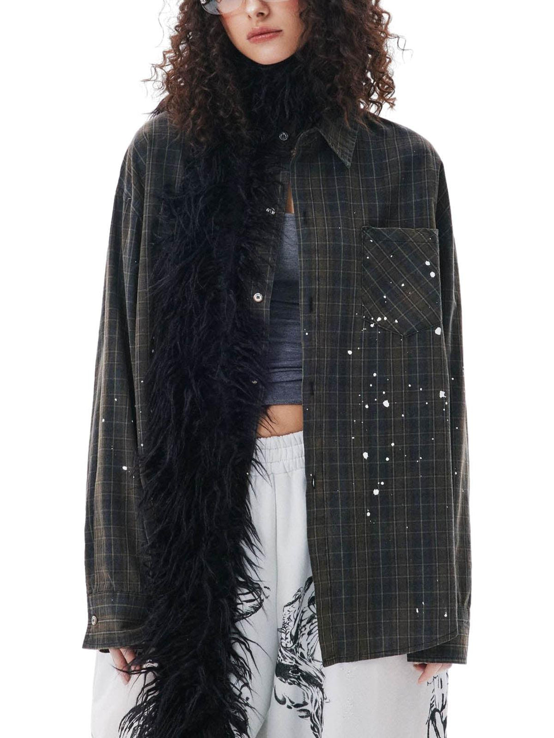 Model styled in a TALISHKO retro plaid shirt with a furry scarf, showcasing eclectic fashion.