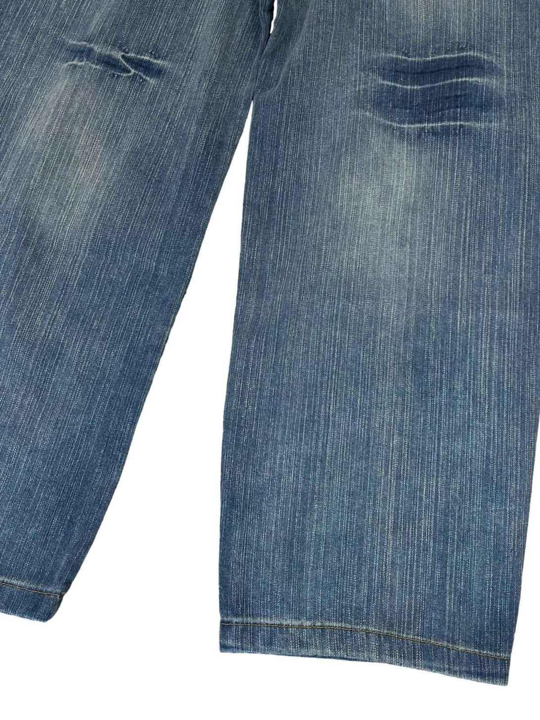 Detailed look at TALISHKO's retro cleanfit washed baggy jeans, highlighting distressed details.
