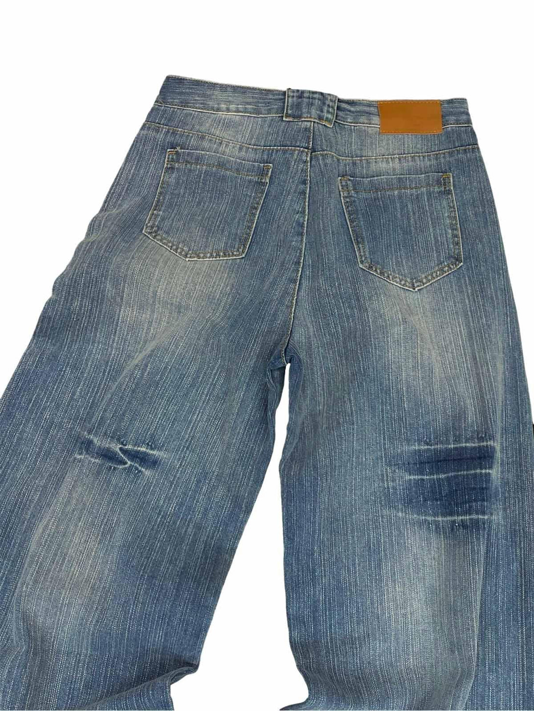 Back view of TALISHKO's retro cleanfit baggy jeans, featuring distressed details and pockets.