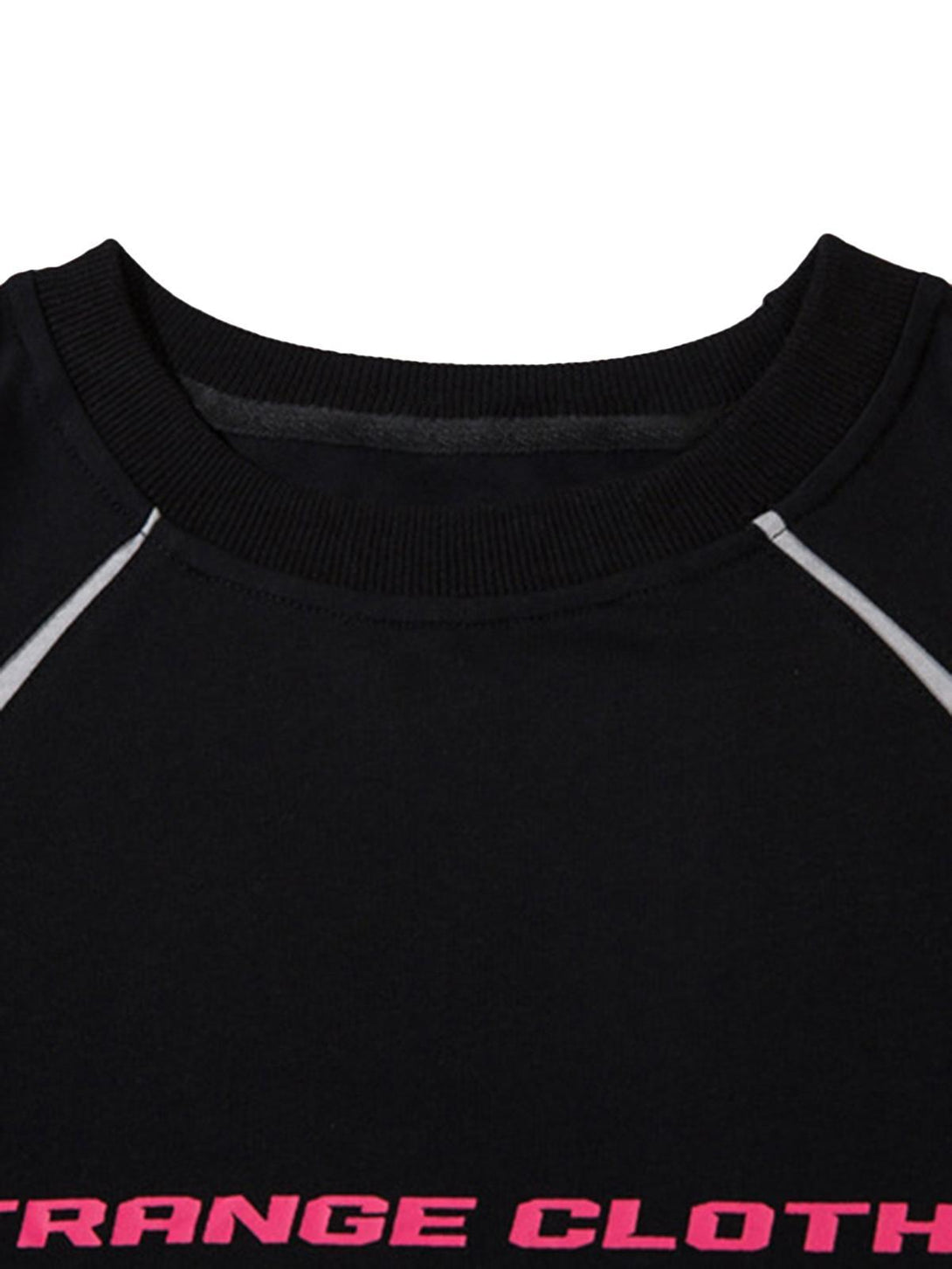 A close-up of TALISHKO's racing T-shirt, highlighting deconstructed stitching and pink lettering.