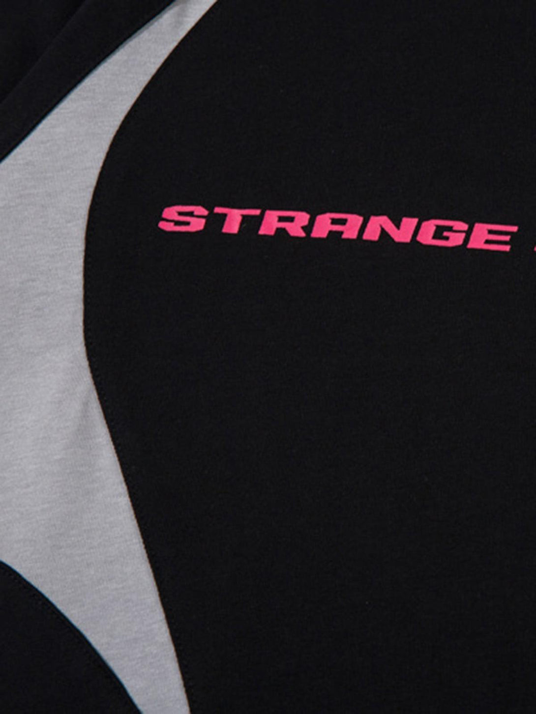 TALISHKO's color-blocked T-shirt with bold pink lettering and deconstructed stitching detail.