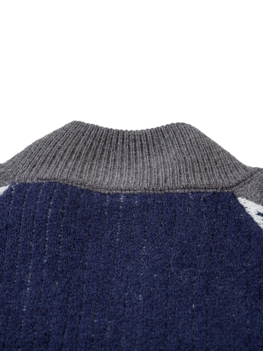 Intricate look at the ribbed collar on a TALISHKO retro contrast color knitted sweater.