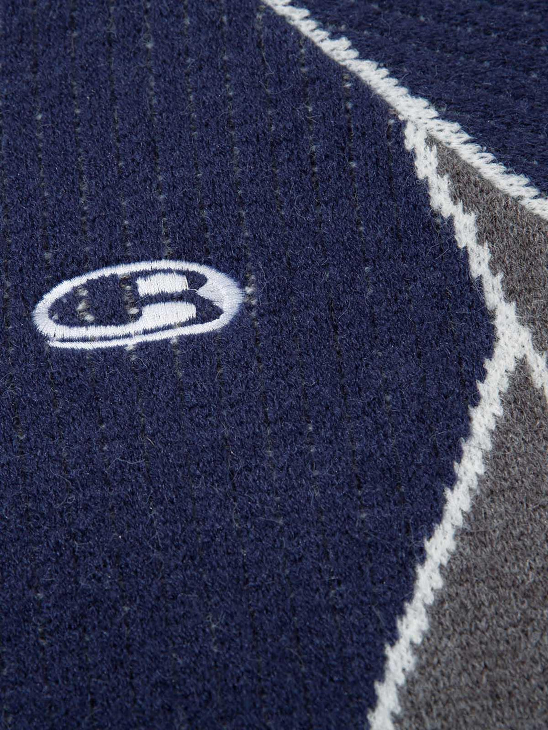 Texture and pattern showcased on a TALISHKO retro contrast color cardigan sweater.