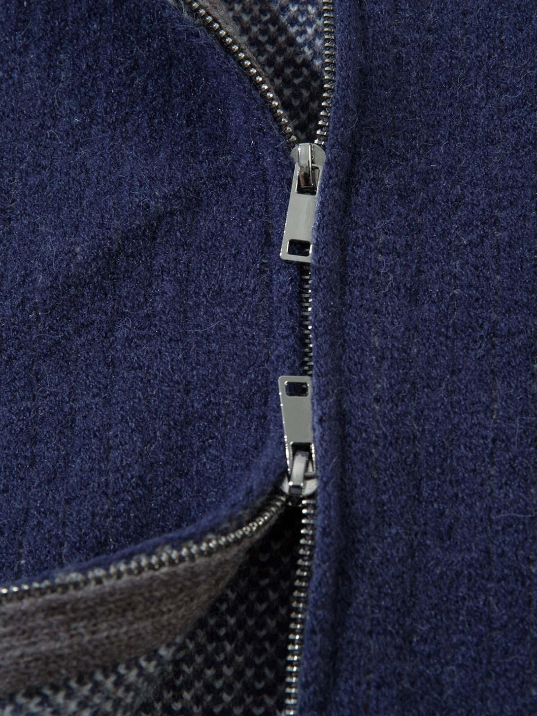 Focusing on the textured zipper detail of a TALISHKO retro contrast color cardigan sweater.
