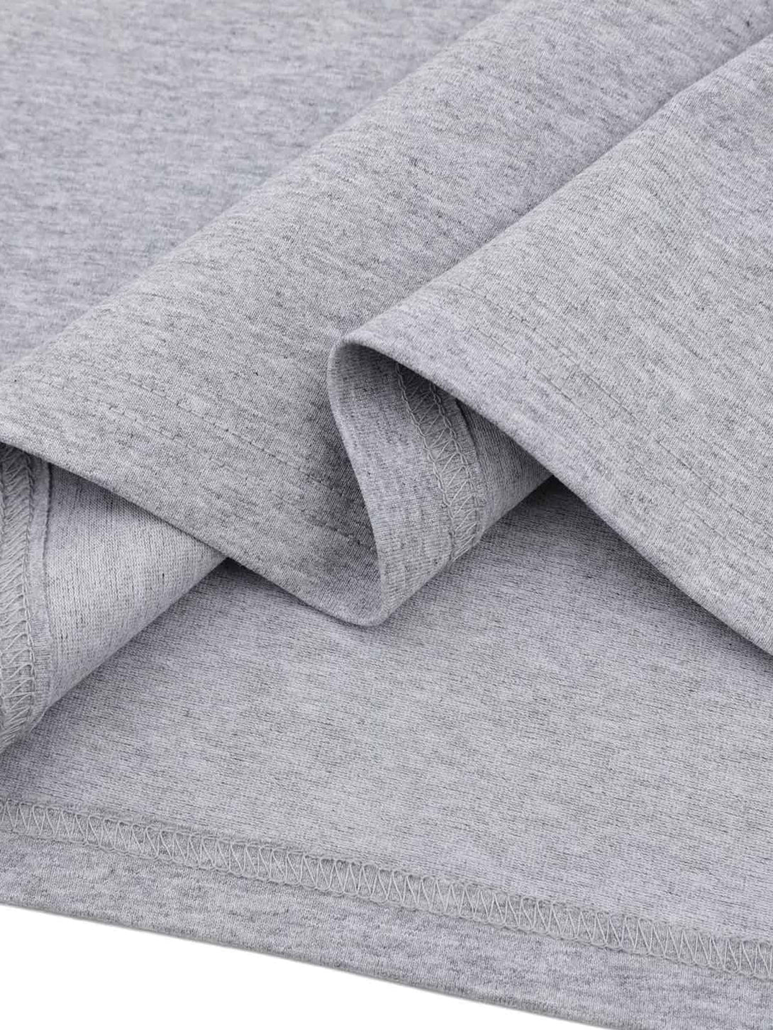 Detailed fabric and stitching of a TALISHKO T-shirt, showcasing its soft gray texture.