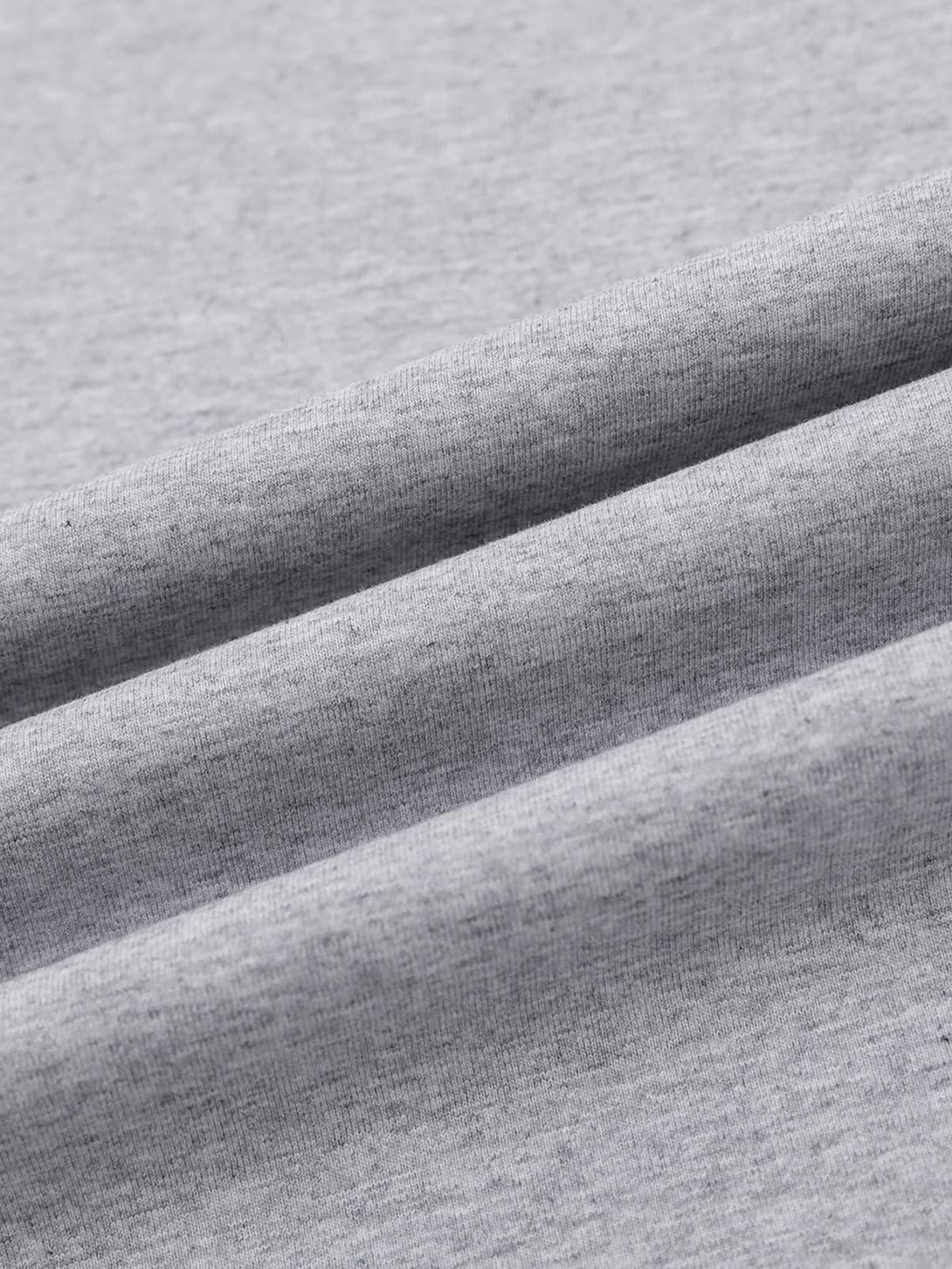 Zoomed-in texture of gray fabric by TALISHKO, showcasing its soft and smooth quality.