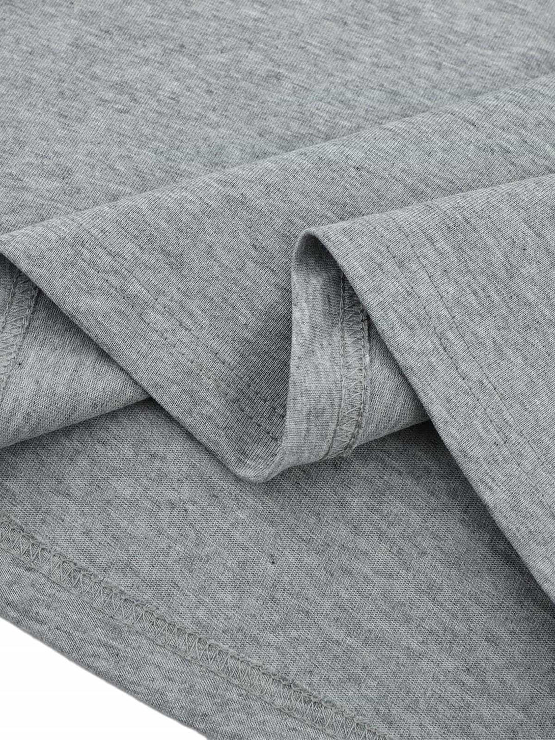 Intricate look at TALISHKO T-shirt fabric, featuring retro stitching and subtle texture.