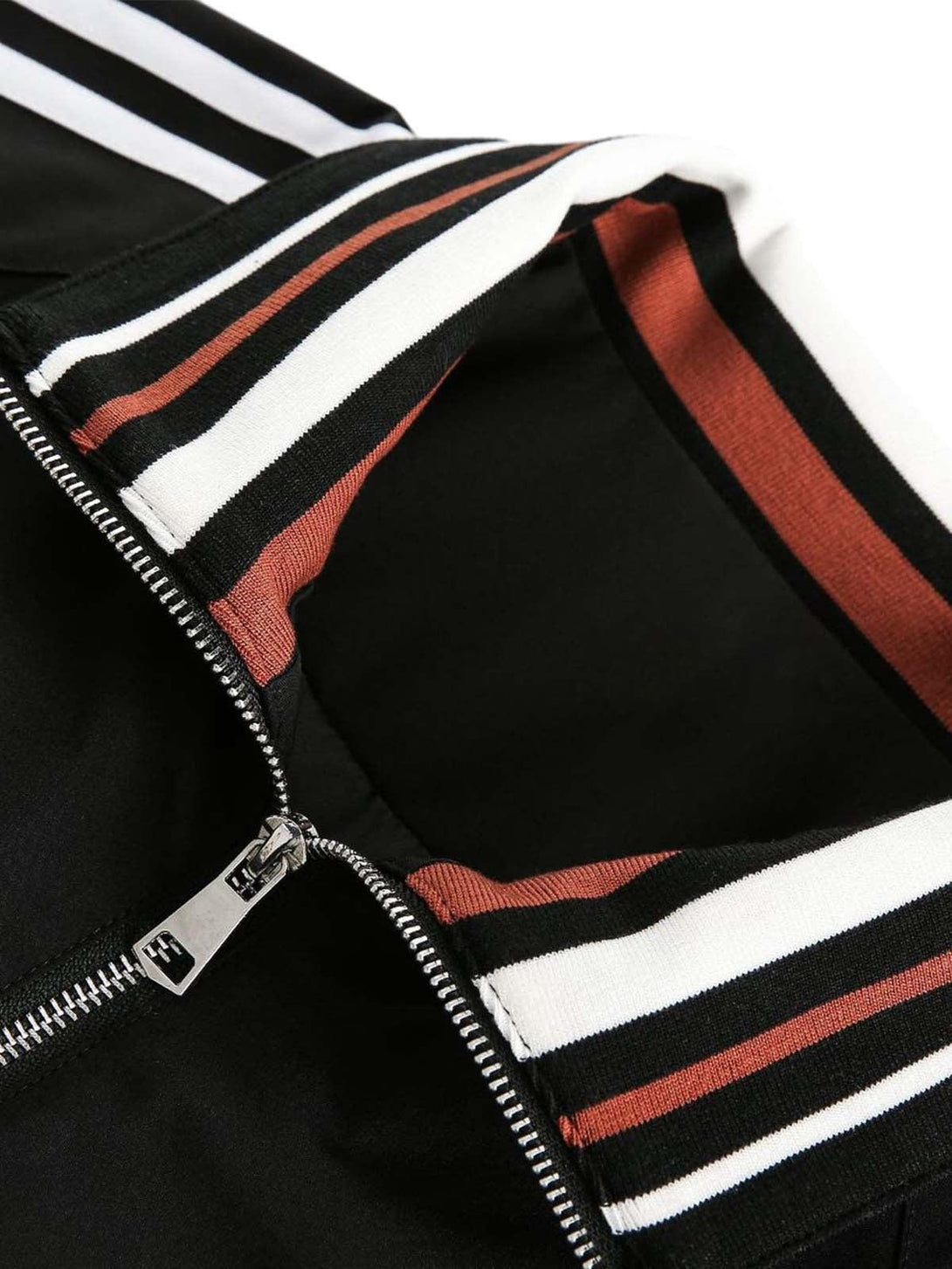 A detailed look at the TALISHKO jersey jacket's retro striped collar and zipper design.