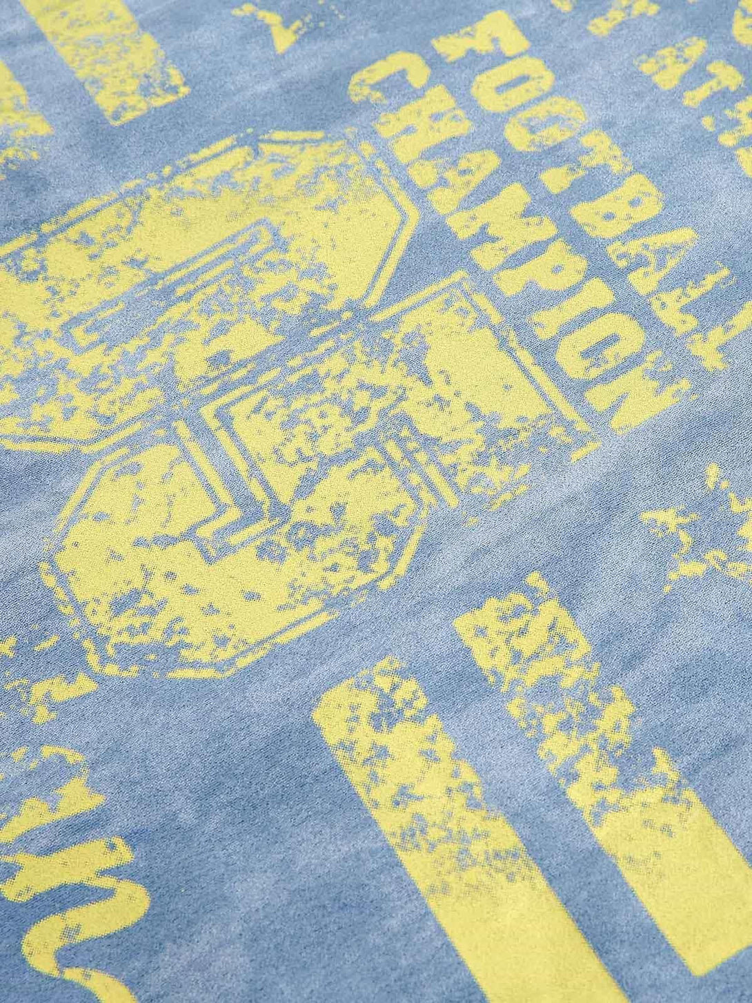 Focusing on vintage yellow graphics and texture on a TALISHKO retro suede track jacket.