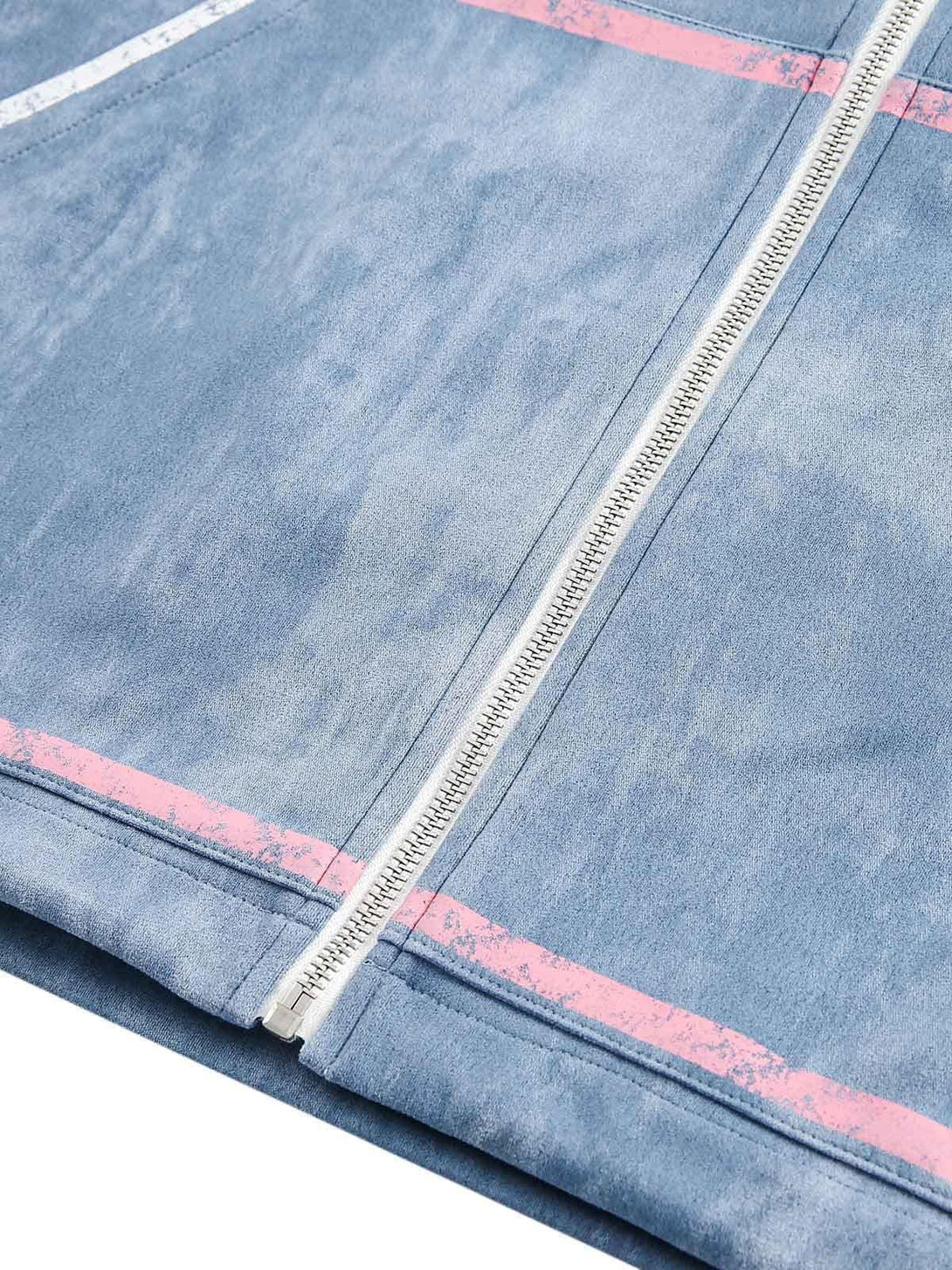 Intricate look at the TALISHKO retro suede track jacket, highlighting the pink contrast stripe.