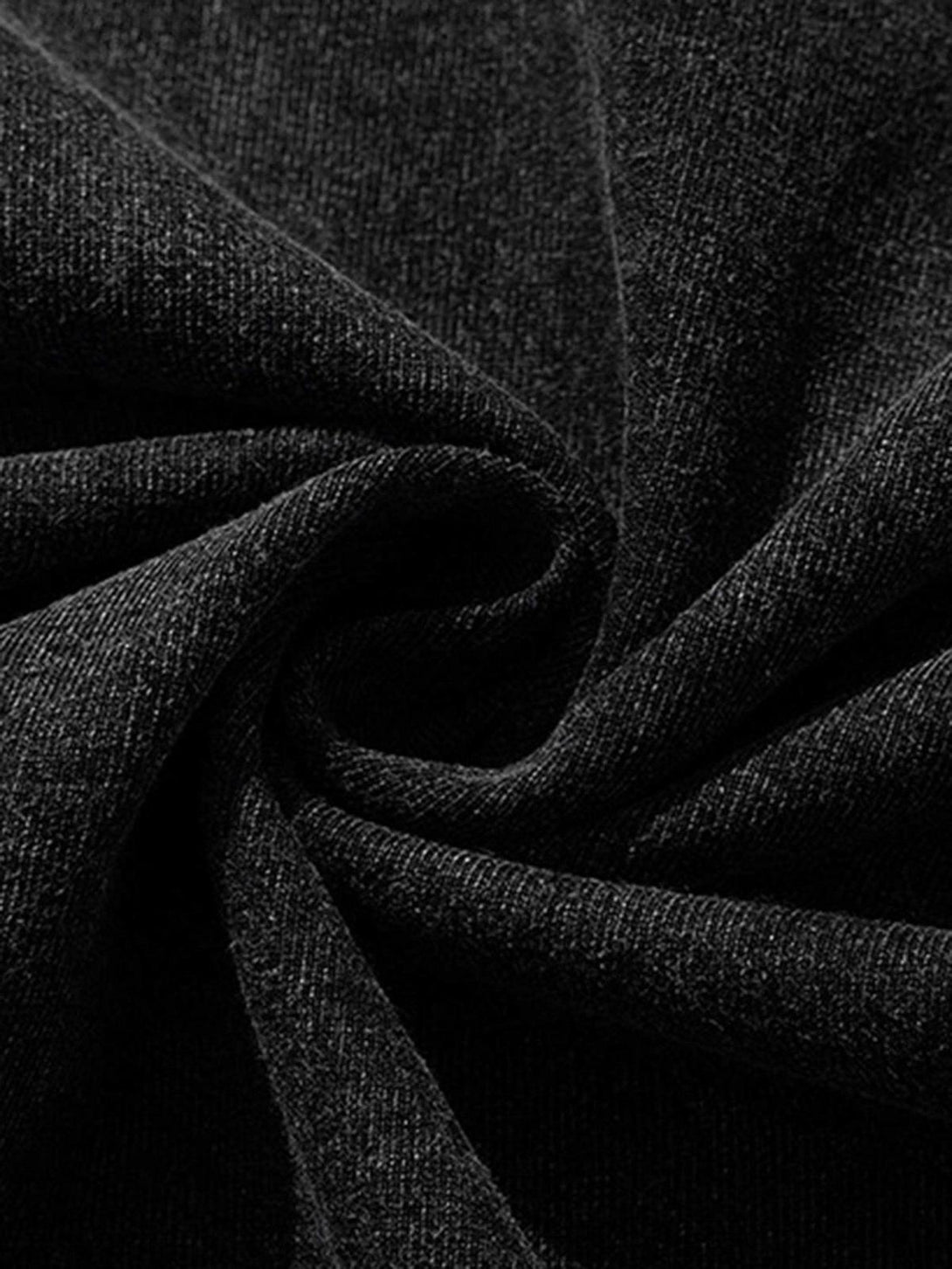 Zoomed-in texture of TALISHKO's retro T-shirt, revealing its intricate black fabric weave.