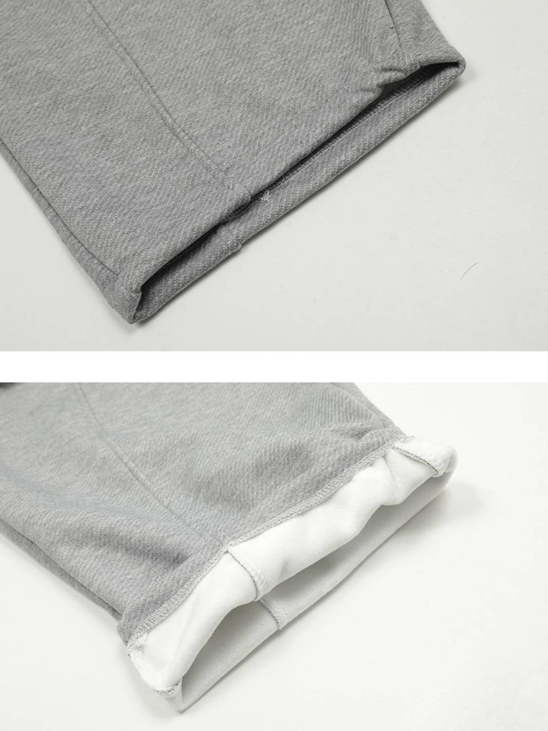 A detailed look at the gray sweatpants' hem by TALISHKO, highlighting inner fabric texture.