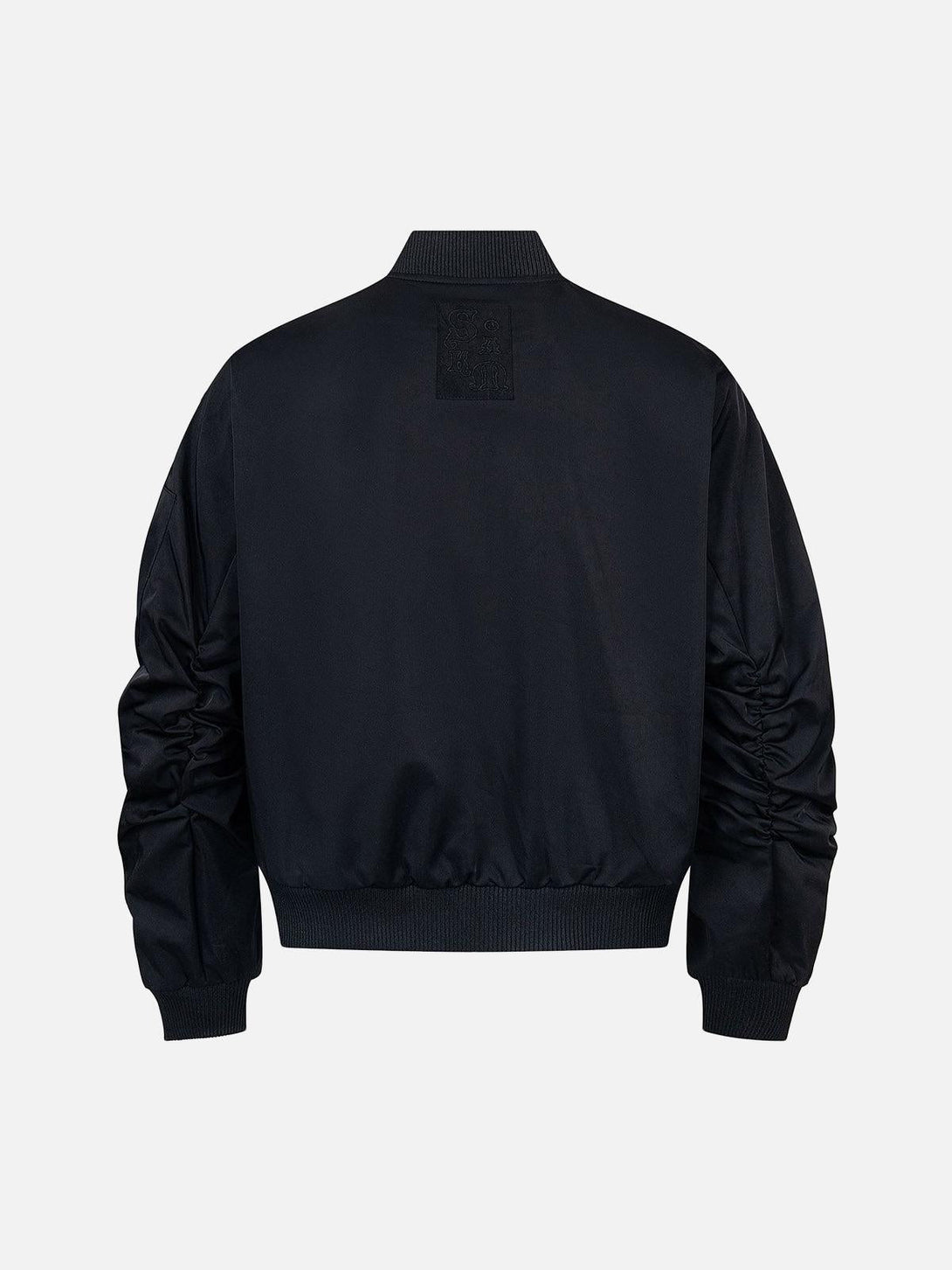 Back view of TALISHKO bomber jacket in black, emphasizing retro deconstructed style.
