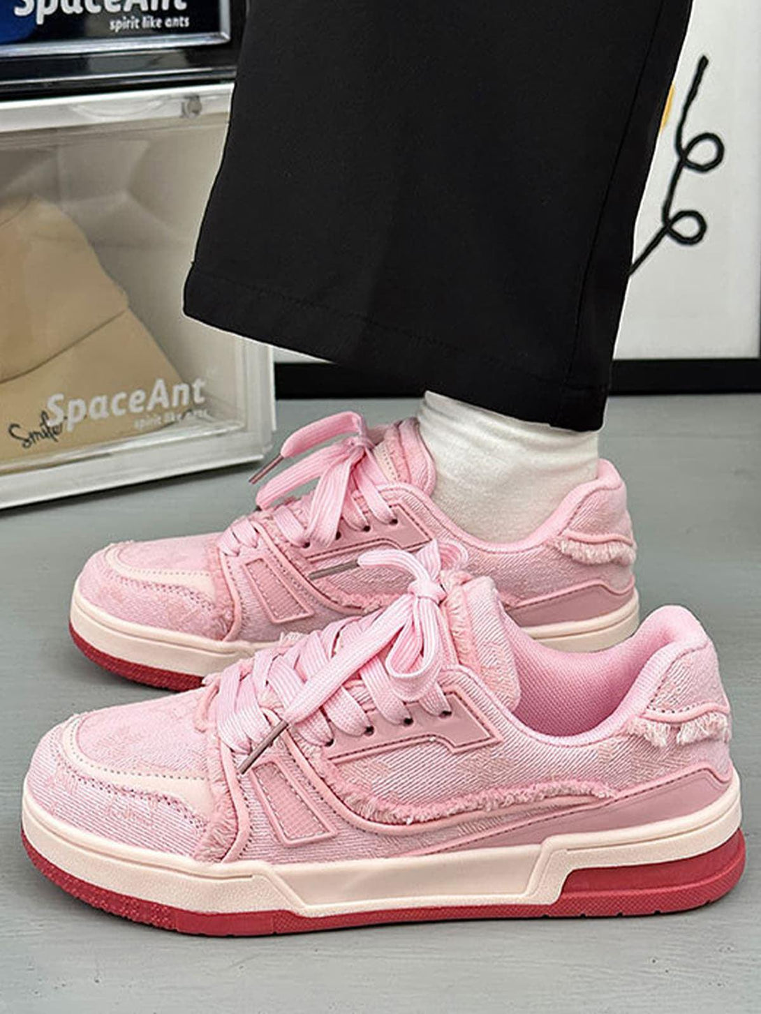 Side view of pink retro denim sneakers by TALISHKO, emphasizing textured design and casual flair.