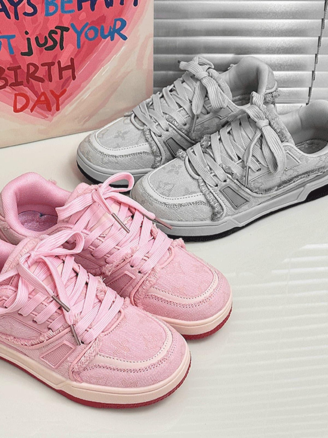 Pink and gray retro denim sneakers by TALISHKO, highlighting vibrant textures and casual flair.