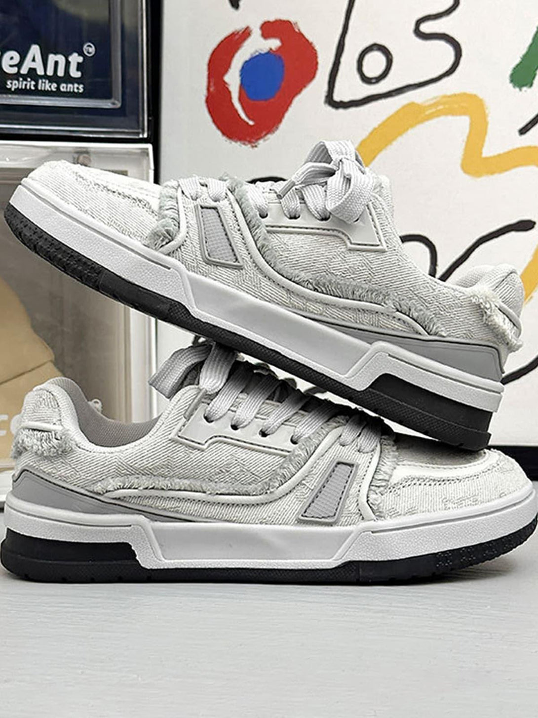 Layered retro denim sneakers by TALISHKO, emphasizing a textured fabric and casual flair.