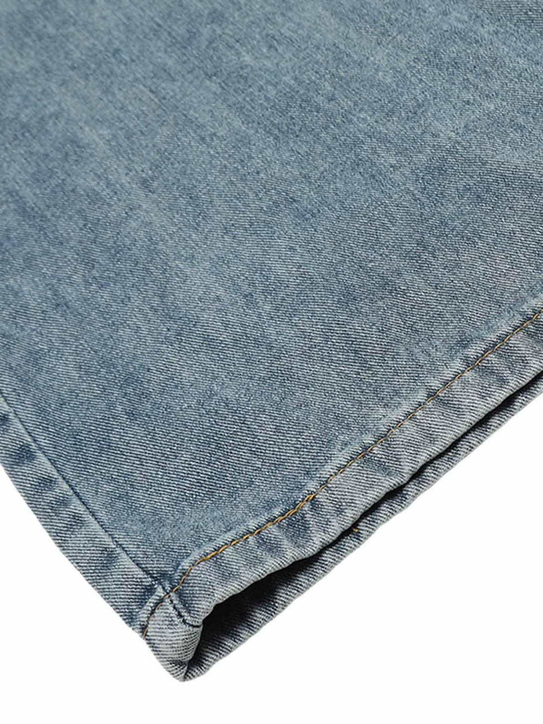 A close-up of TALISHKO's retro jeans fabric, highlighting the denim texture and stitching.