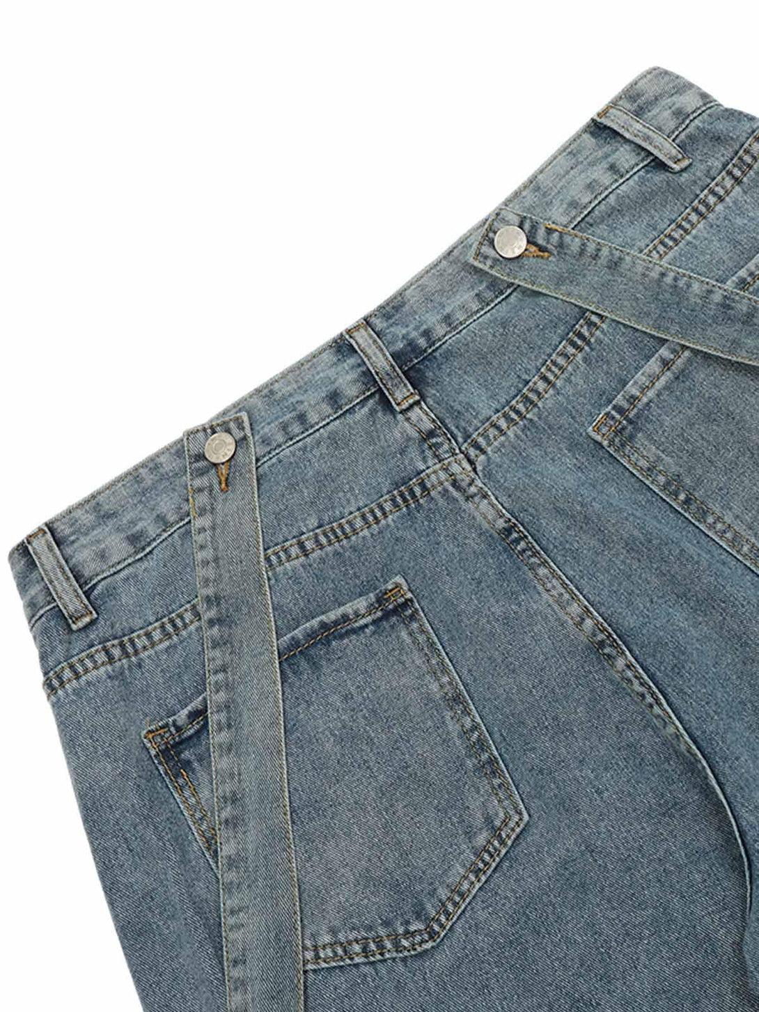 Detailed fabric and stitching of TALISHKO's retro jeans with detachable straps and pockets.