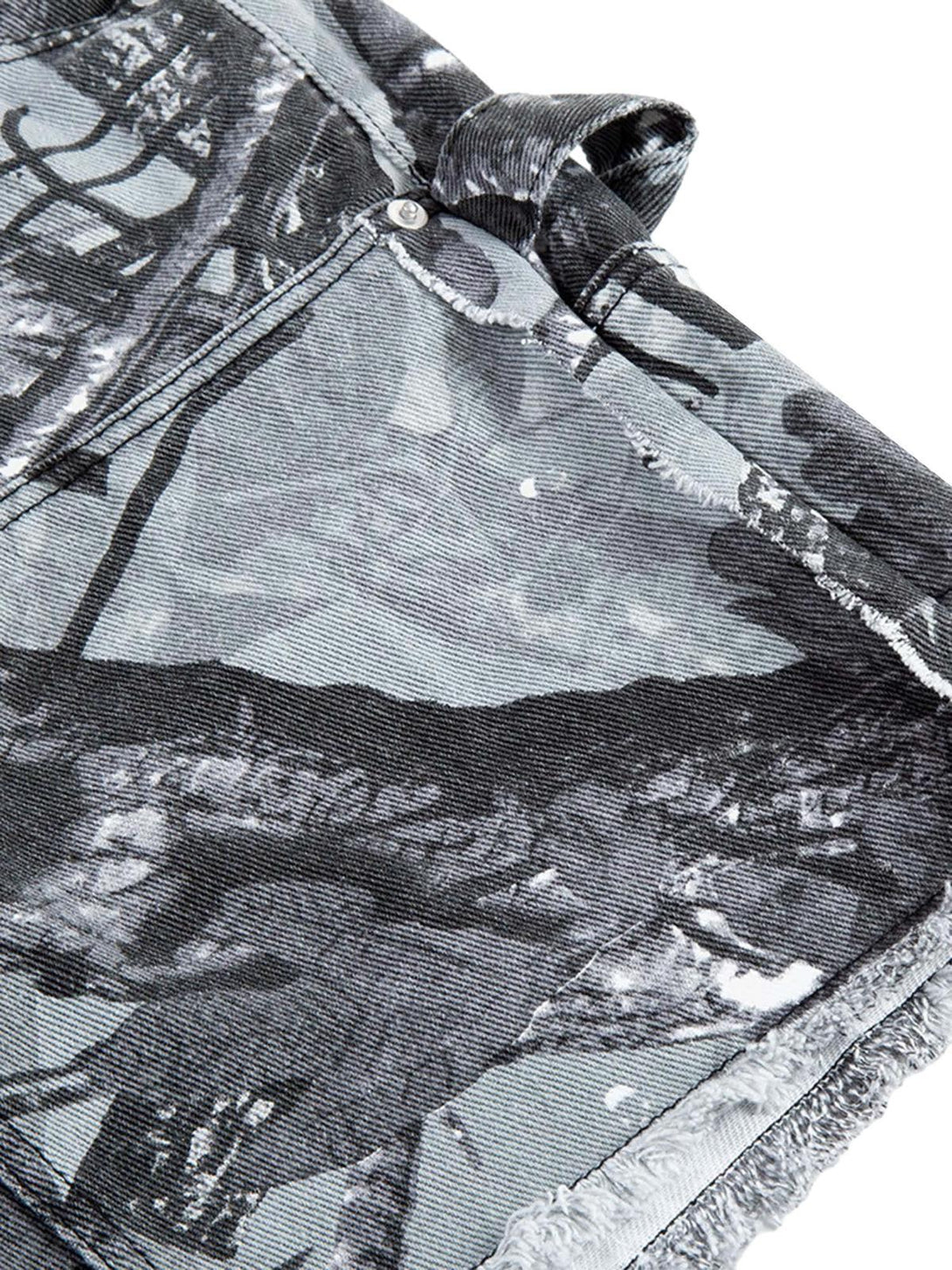 Zoomed-in texture of TALISHKO's retro distressed camouflage shorts, highlighting unique patterns.