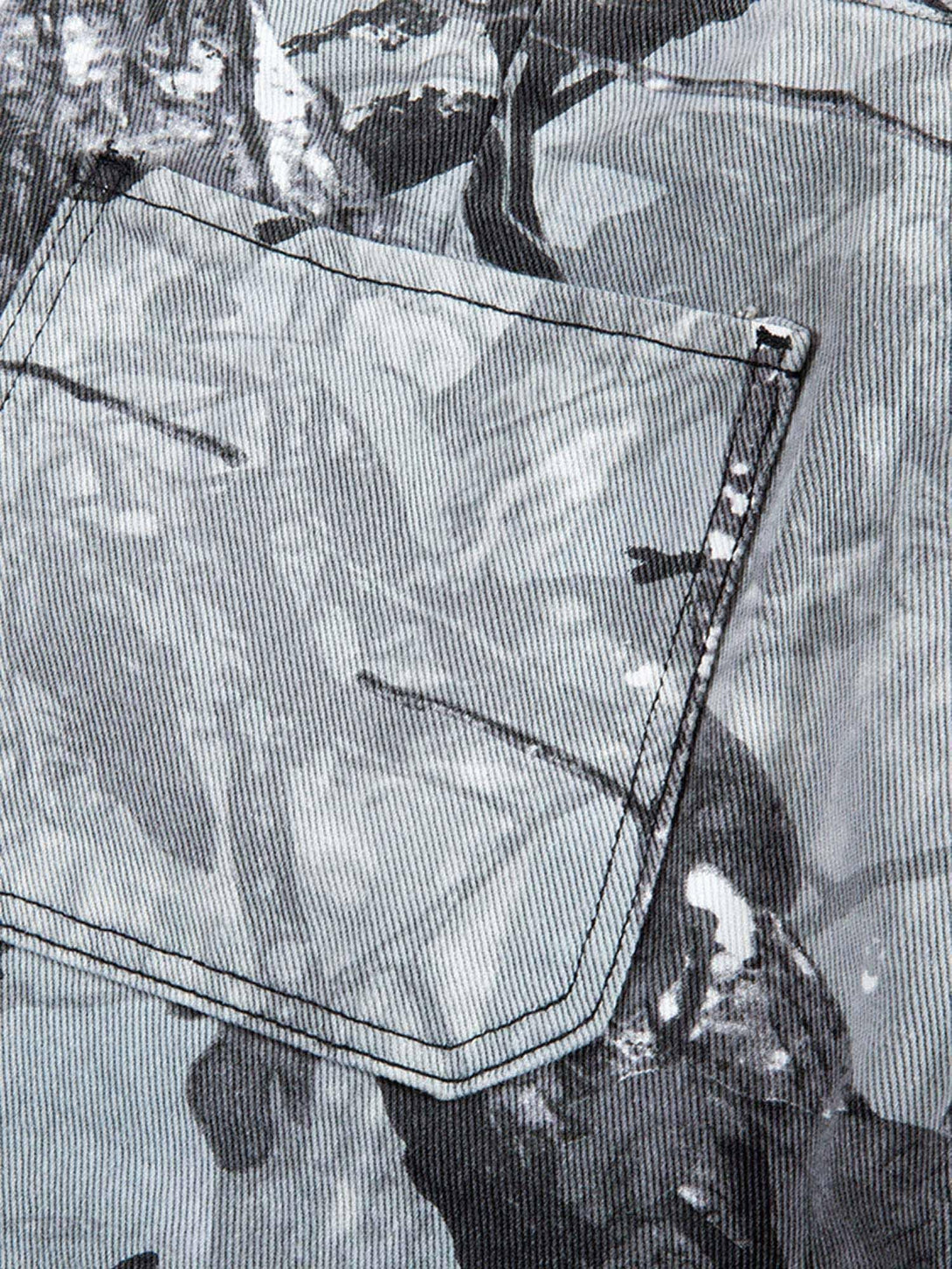 A tight crop highlighting TALISHKO's retro distressed camouflage shorts' pocket detail.