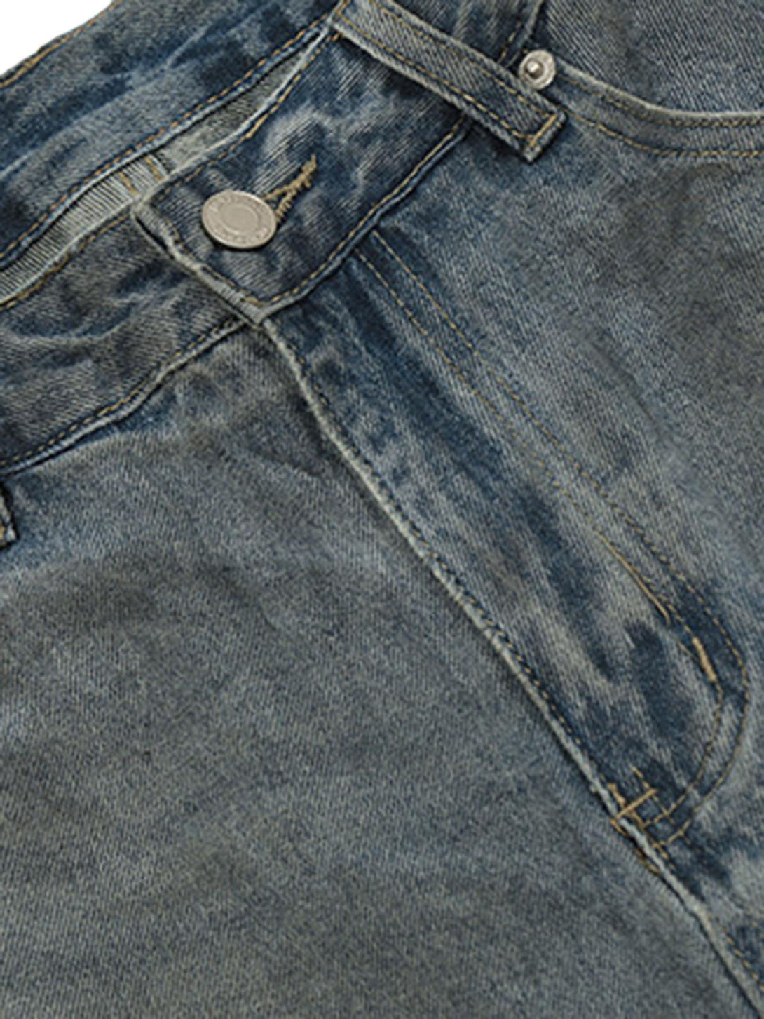 Detailed fabric and stitching on TALISHKO's distressed faux two-piece jeans, capturing a retro feel.