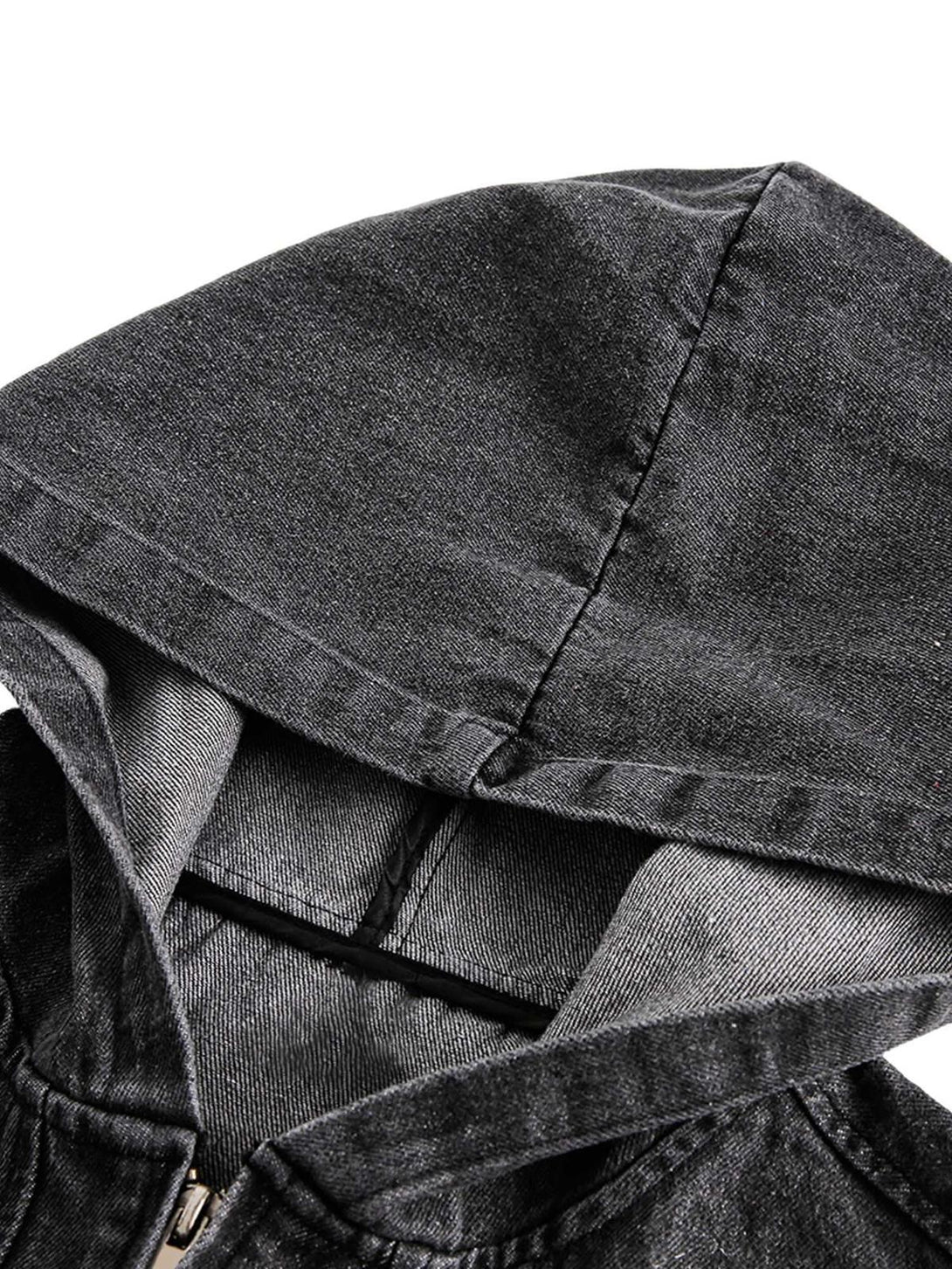 A close-up of TALISHKO's retro distressed denim hoodie, highlighting its washed texture.