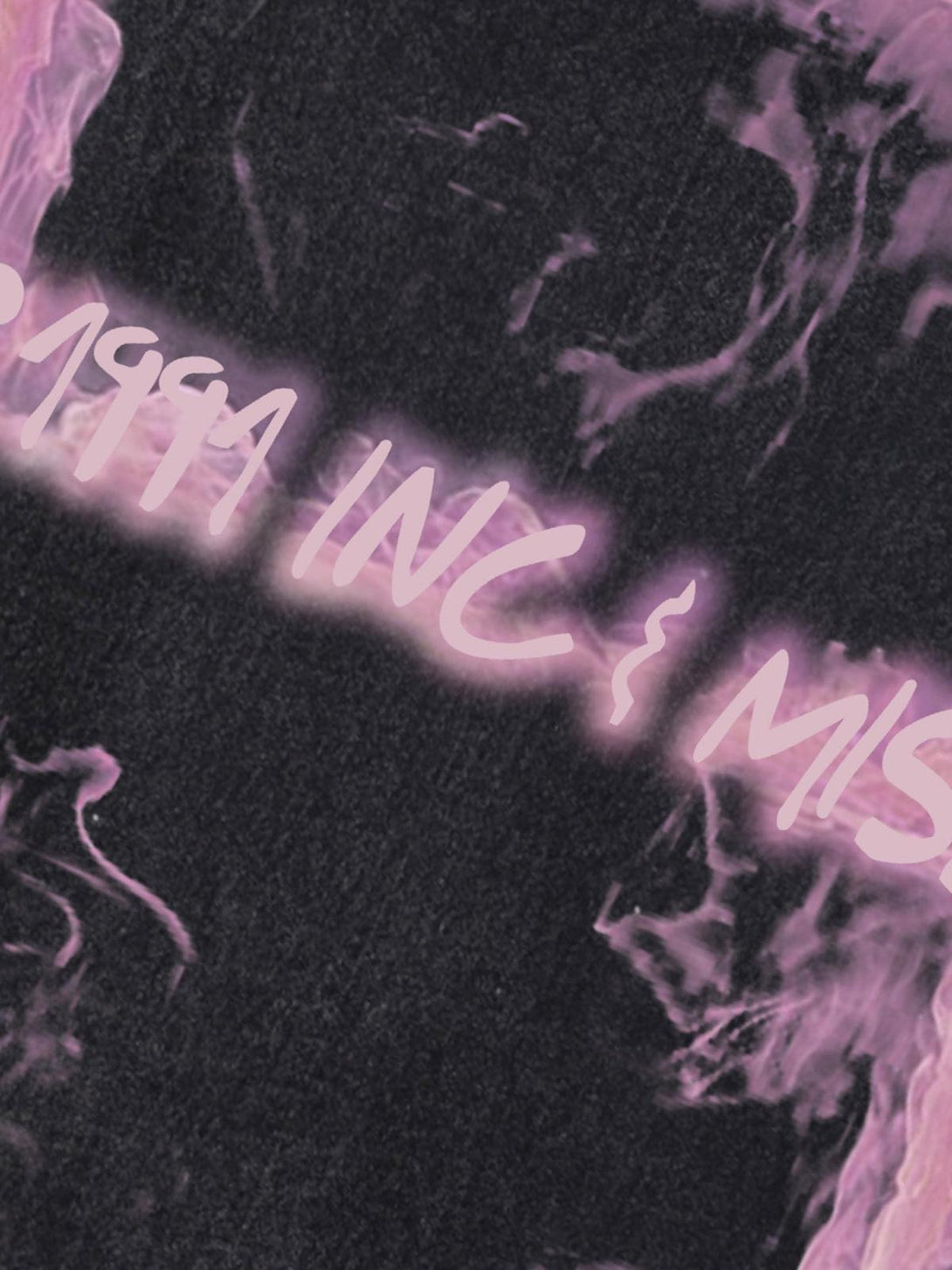 A detailed view of a retro smoked print on a distressed vest, highlighting TALISHKO style.