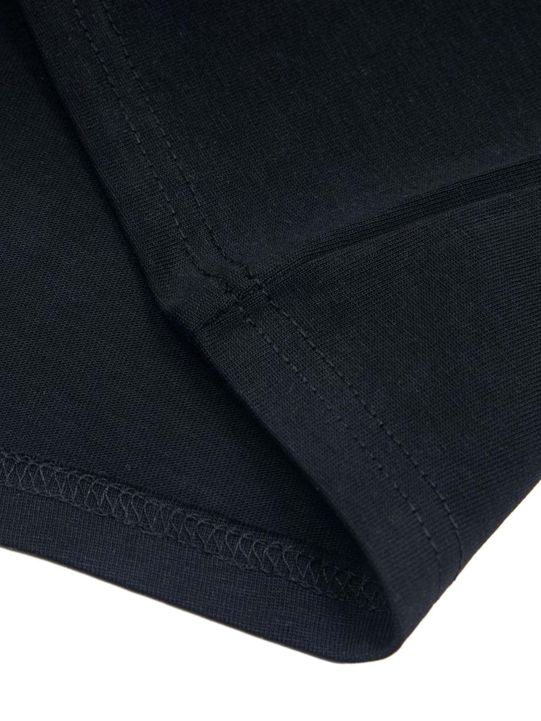 Detailed stitching on TALISHKO's black T-shirt, showcasing quality craftsmanship.