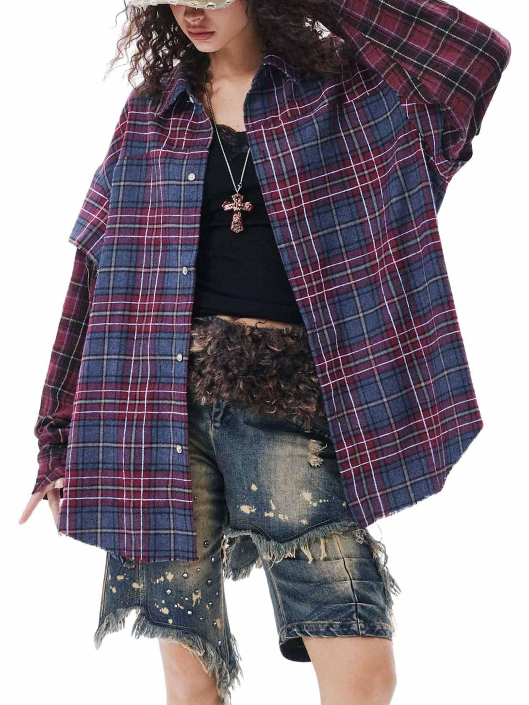 Model wearing a retro plaid shirt by TALISHKO, paired with distressed shorts and accessories.