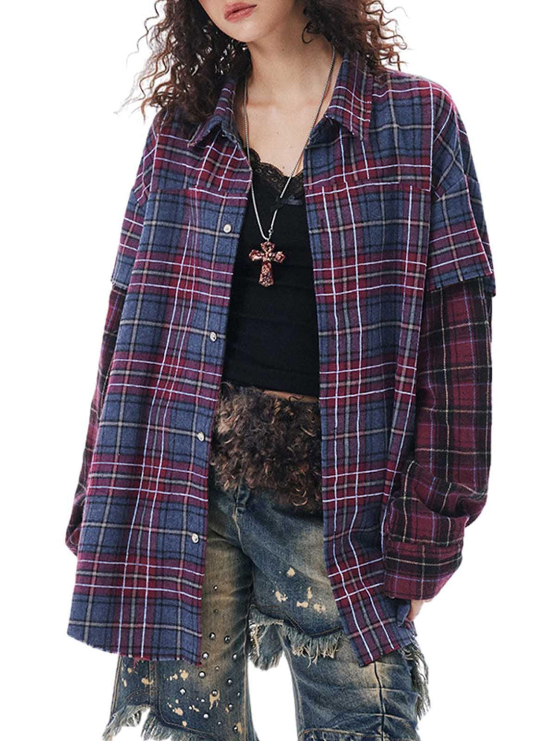 Model in TALISHKO plaid shirt with layered design and cross necklace, paired with distressed jeans.