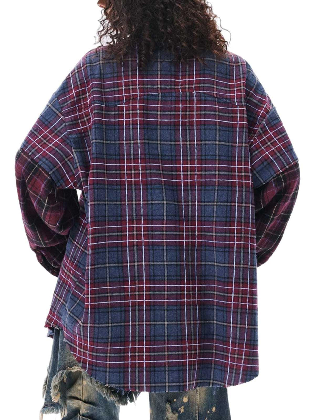 Back view of TALISHKO's retro plaid shirt with a layered design, styled with distressed jeans.