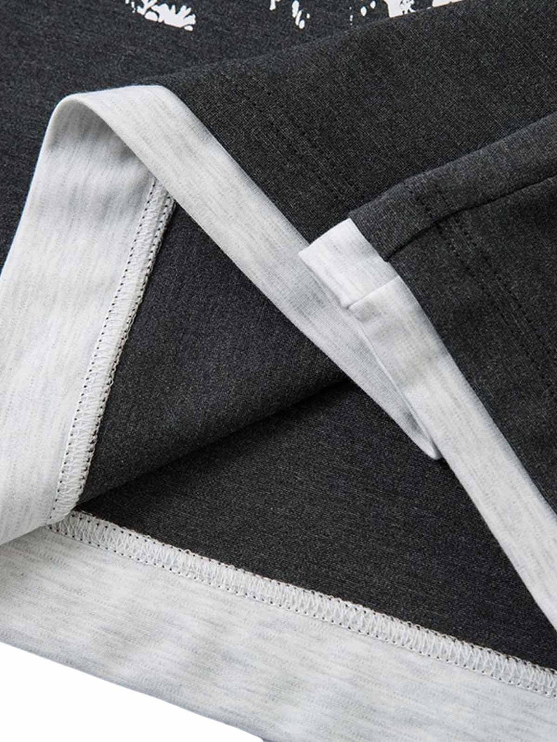 Detailed fabric and stitching on TALISHKO's retro faux two-piece T-shirt, showcasing quality.