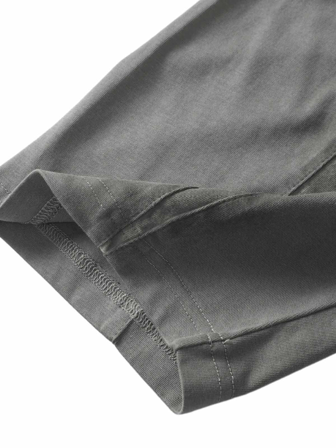 Intricate hem stitching on TALISHKO's retro T-shirt, showcasing detailed craftsmanship.