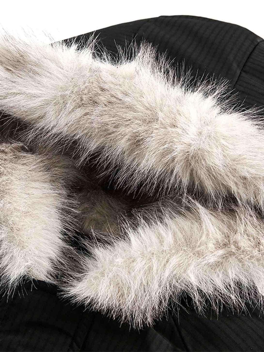 Focusing on the plush fur hood detail of the TALISHKO fleece bomber jacket, showcasing elegance.