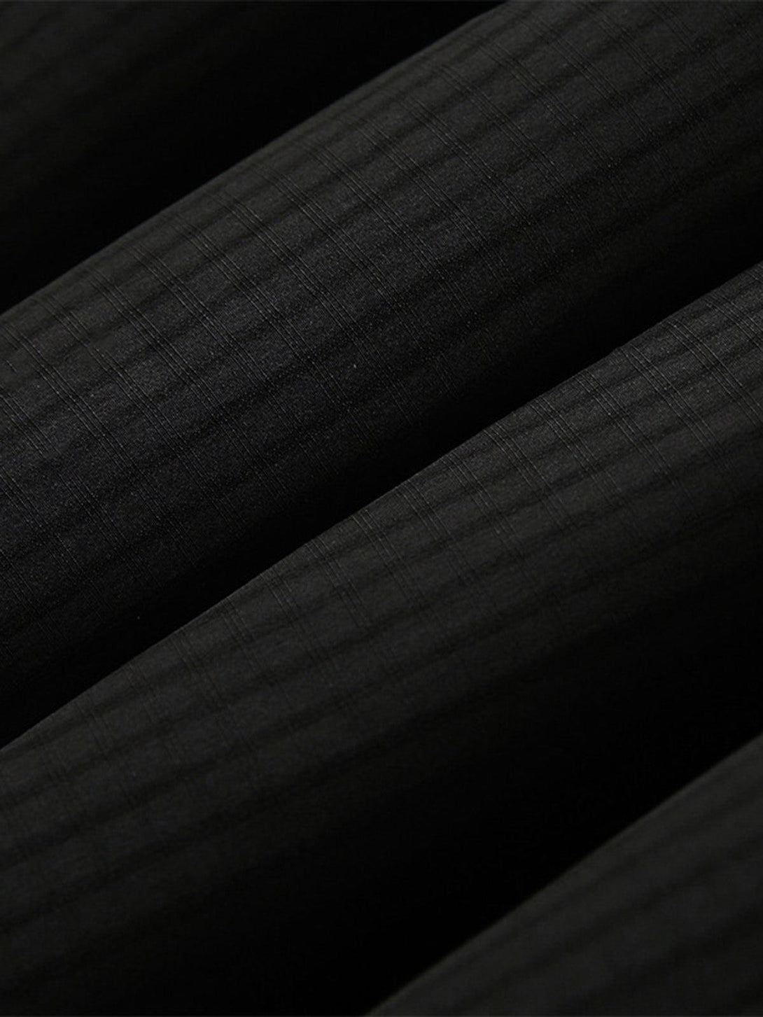 Texture and pattern showcased on the TALISHKO fleece bomber jacket fabric, highlighting detail.