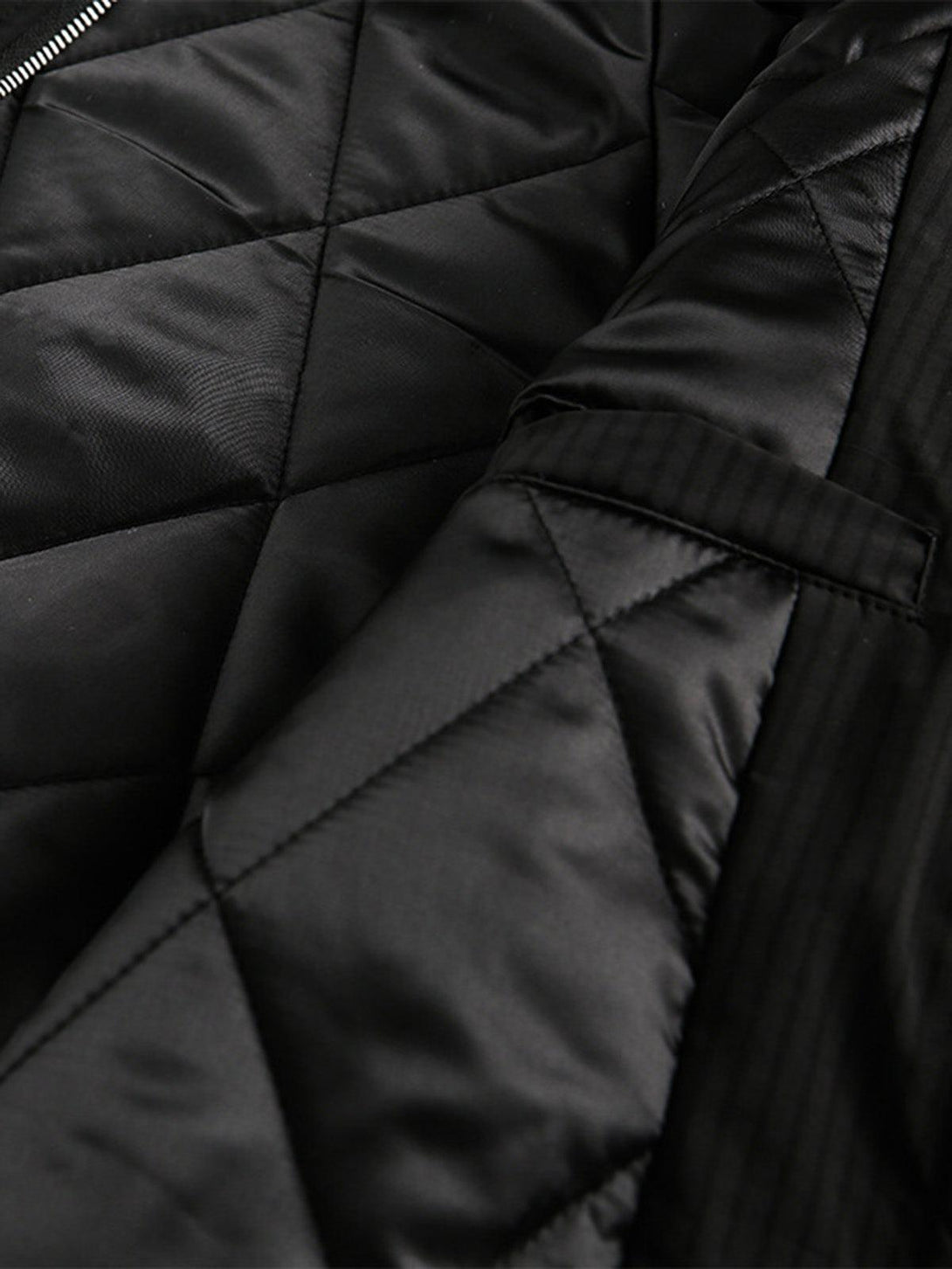 Intricate look at the quilted interior design of the TALISHKO bomber jacket, showcasing craftsmanship.