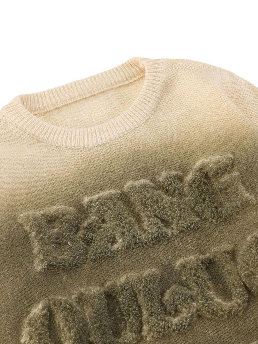 Focusing on the textured lettering detail of a TALISHKO retro gradient crewneck sweater.