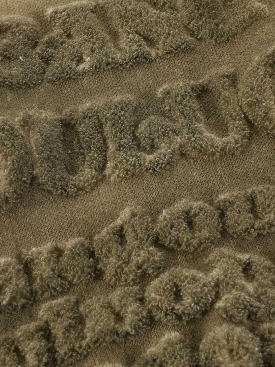 Intricate texture and lettering detail on a TALISHKO retro gradient crewneck sweater.