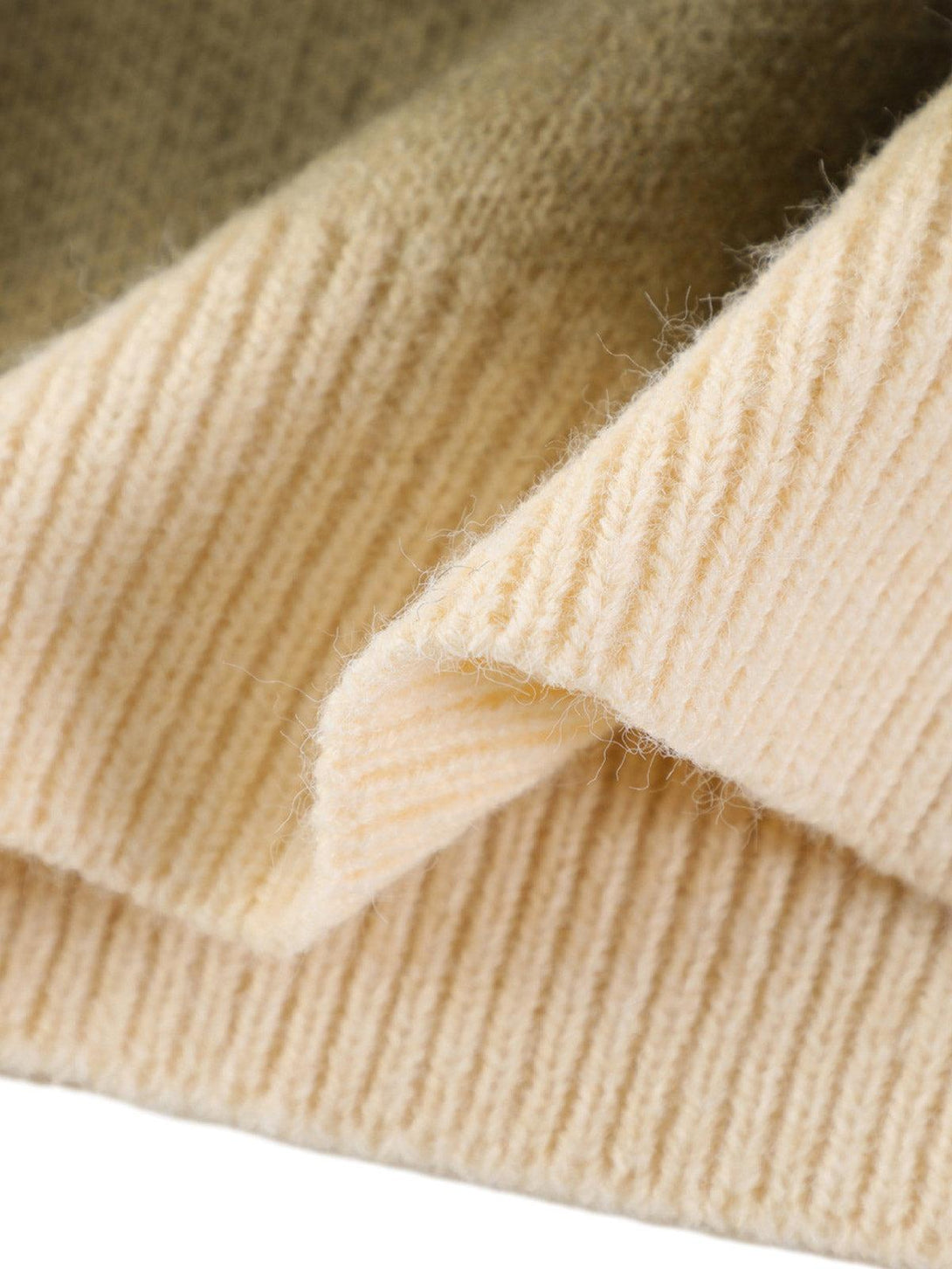 A close-up of the soft texture on a TALISHKO retro gradient crewneck sweater.